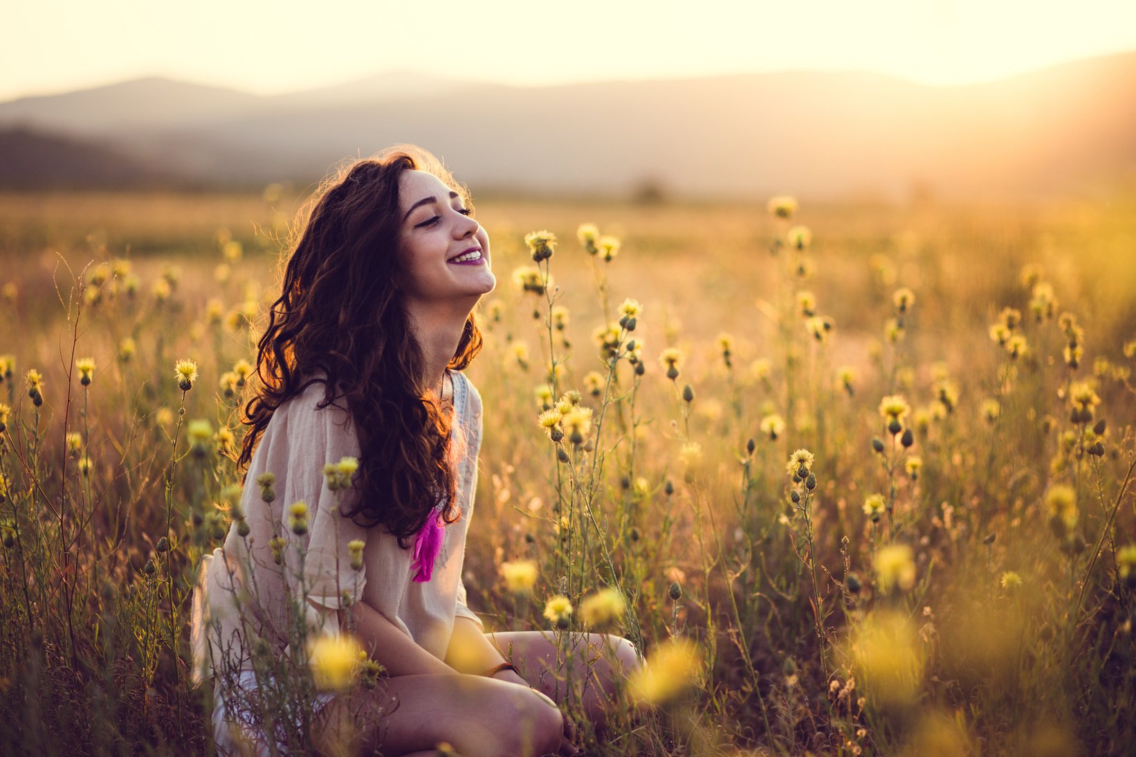 Happy Girl Meditating In Blossom Meadow